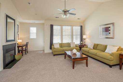 A living room with a fireplace and a couch.