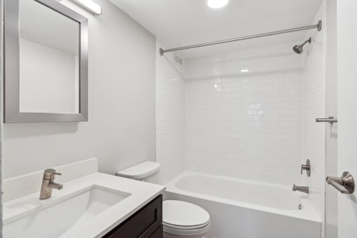 Bright tub shower combo at Park Montgomery apartments located along the Purple Line in Silver Spring, MD.