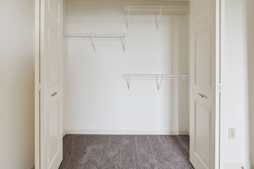 a walk in closet in a 555 waverly unit