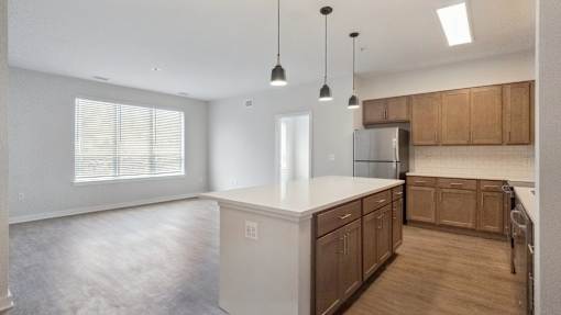 A kitchen with wooden cabinets and a white countertop.