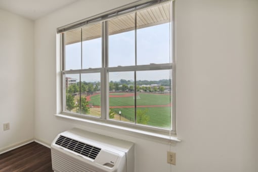 a large window with a view of a baseball field