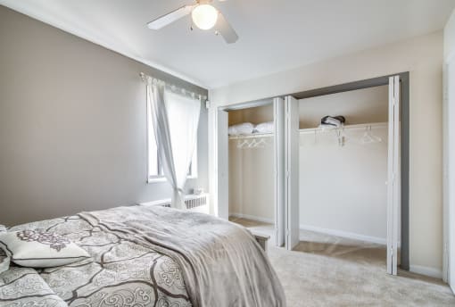 Comfortable bedroom with generous space, bright windows, and neutral tones at Meadowbrook Run, ideal for creating a restful personal retreat in Southeast Washington, D.C.
