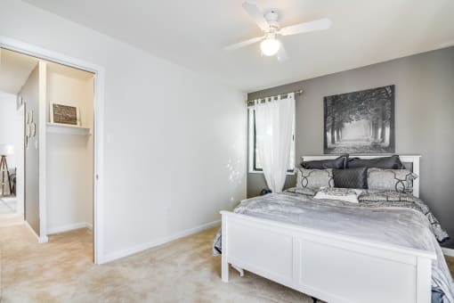 Comfortable bedroom with generous space, bright windows, and neutral tones at Meadowbrook Run, ideal for creating a restful personal retreat in Southeast Washington, D.C.