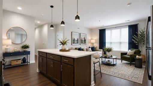 A modern kitchen with dark wood cabinets and a white island.