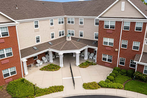 A large brick building with a courtyard in the middle.