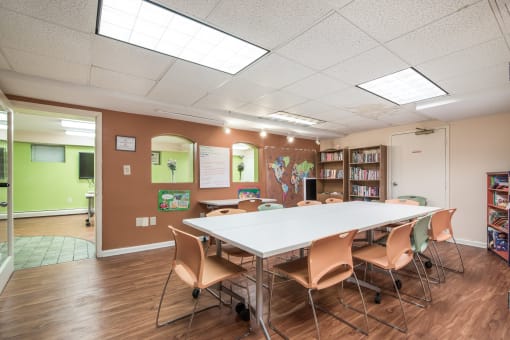 Inviting community room at Meadowbrook Run Apartments designed for resident gatherings and social events, with comfortable seating and open layout.