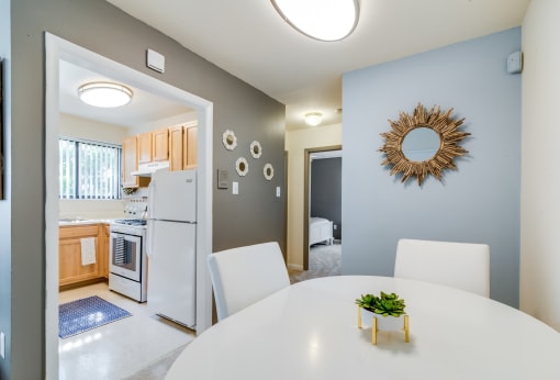 Bright and inviting dining area inside a Meadowbrook Run apartment home in Congress Heights, D.C., featuring hardwood-style flooring, neutral tones, and ample space for a dining table—perfect for everyday meals or entertaining guests.