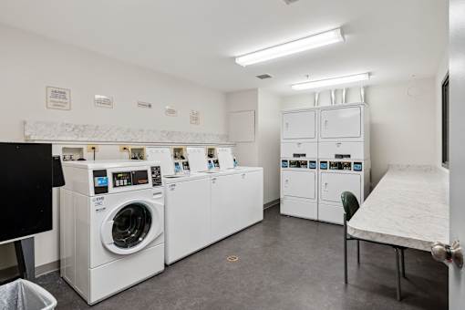 Accessible on-site laundry room at Park Heights Place senior apartments for resident convenience.