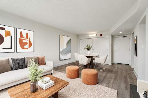 Open-concept layout in a market-rate 2-bedroom apartment at Edgewood Commons 611 & Gardens, combining the kitchen, dining, and living spaces into a seamless and functional living experience.