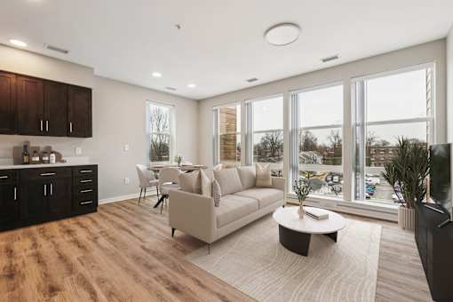A modern living room with a large couch and a coffee table.