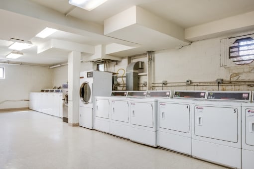 Clean and convenient on-site laundry facilities at Meadowbrook Run Apartments, offering washers and dryers for residents.