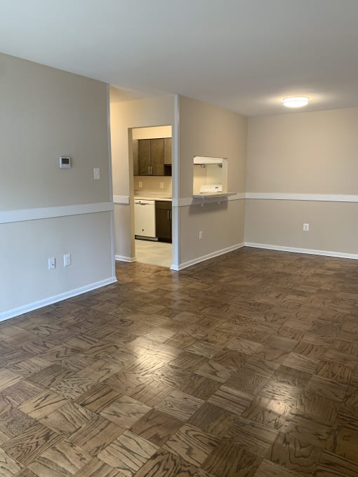 A kitchen and living space at Randle Hill affordable apartment community located in Washington, DC