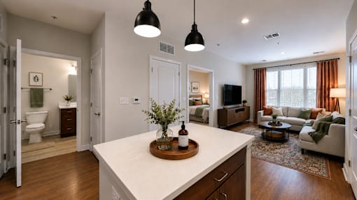 A modern kitchen with a white countertop and wooden cabinets.