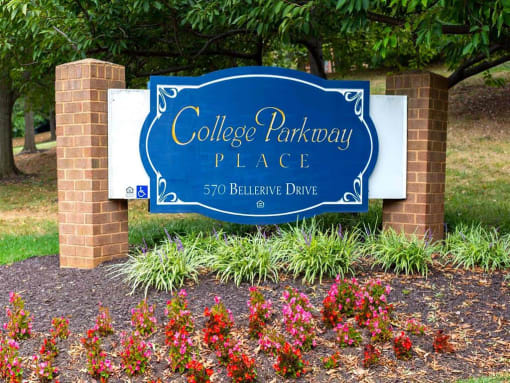 Mid-rise apartment building at College Parkway Place featuring elevator access, controlled entry, off-street parking, and landscaped grounds in the heart of Annapolis, MD.