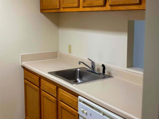 Well-appointed kitchen with ample cabinet space and modern appliances, part of a thoughtfully designed apartment at College Parkway Place, a family-friendly mid-rise community in historic Annapolis.