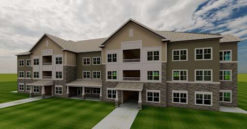 A large, modern building with a stone facade and multiple balconies.
