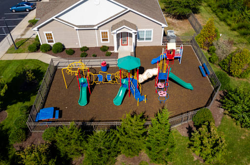 A playground with a slide, swings, and a ball pit.