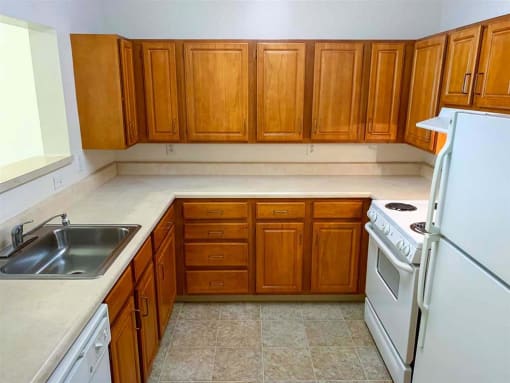 Modern, full kitchen in a senior apartment at Park View at South Pantops, complete with energy-efficient appliances, ample cabinetry, and easy-to-clean surfaces for convenience and safety.