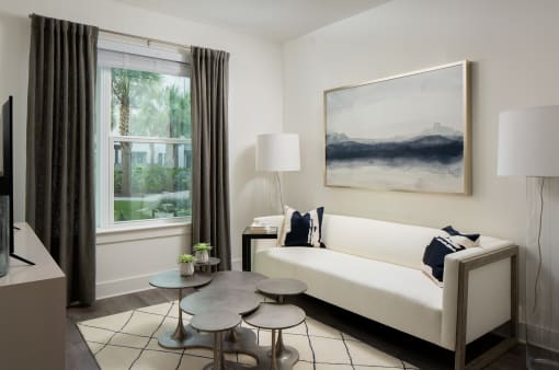 Living room with sofa and wall frames at Allure on Parkway, Lake Mary, Florida
