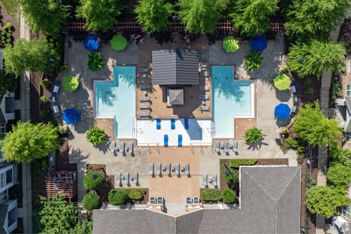 arial view of the roof of a house with a pool and trees at Grand Oak at Town Park, Smyrna, TN