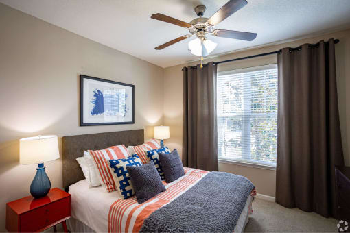 a bedroom with a bed and a ceiling fan at Grand Oak at Town Park, Smyrna, Tennessee