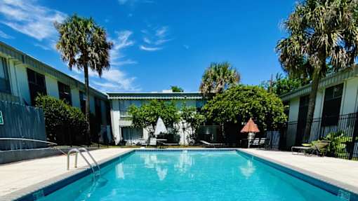 a swimming pool in front of a building