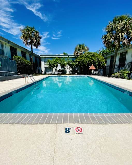 A pool with a height restriction sign of 8 feet.