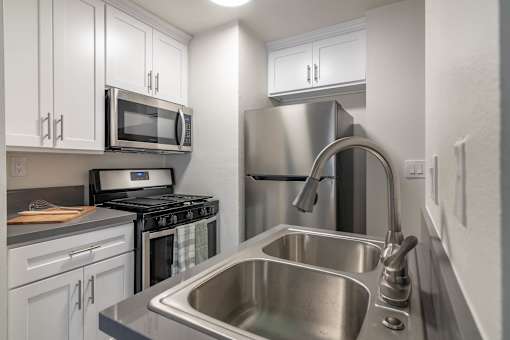 Kitchen with stainless steel sink and new appliances