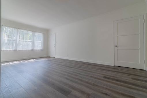 Living area with 3 large windows and view