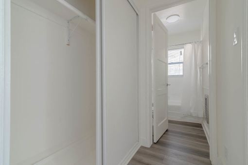 Interior hallway closet view to bathroom