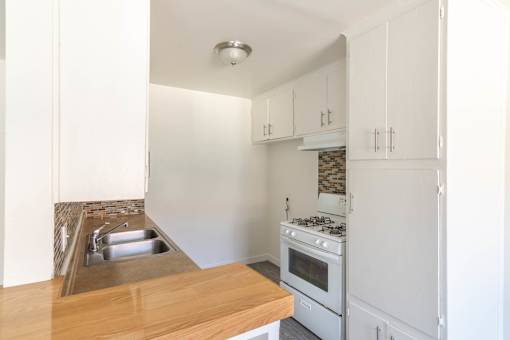 Kitchen with nw counters and appliances