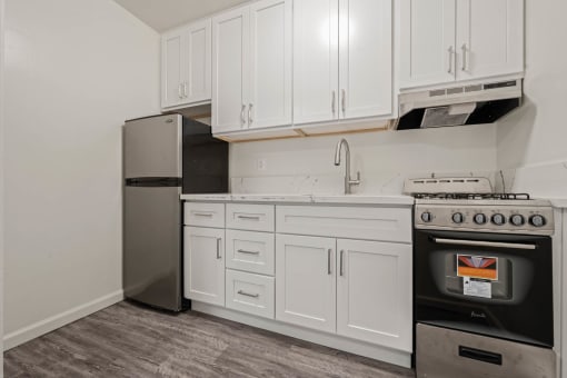 Kitchen appliances and cabinets at Beverly Boulevard Apartments, California, 90004