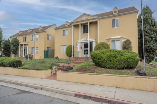 Exterior view with plants at Beverly Boulevard Apartments, California
