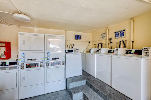 A laundromat with washers and dryers.
