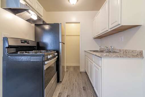 Kitchen with new counters appliances and flooring
