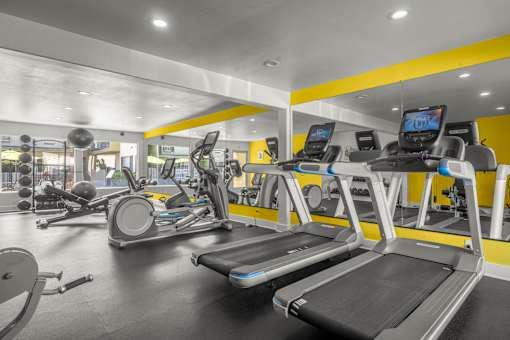A gym with treadmills and other exercise equipment at Sunset Square, West Covina, 91790