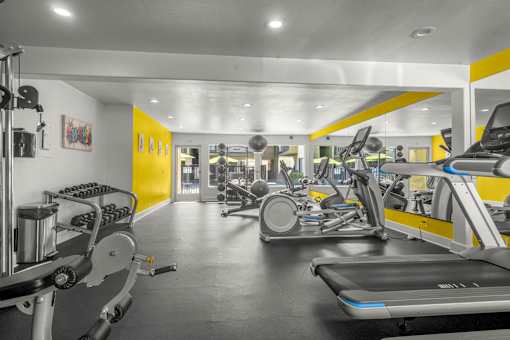 A gym with treadmills, exercise bikes, and other equipment at Sunset Square, West Covina, 91790