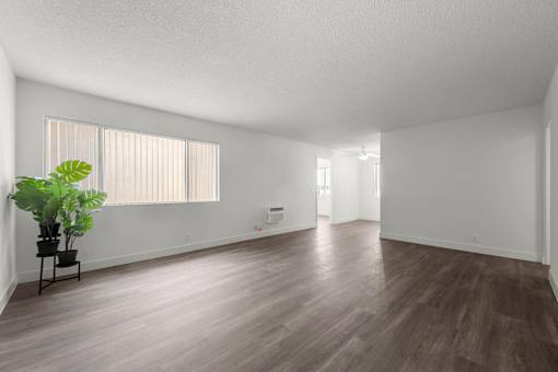 A room with wooden floors and a plant on a table at Sunset Square, West Covina, 91790