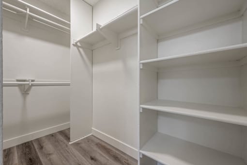 the closet in a bedroom with white shelves at Monterra Ridge Apartments, California,91351