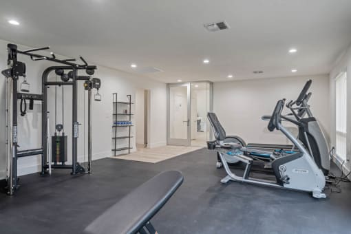 a gym with treadmills and other exercise equipment in a room at Monterra Ridge Apartments, Canyon Country, California
