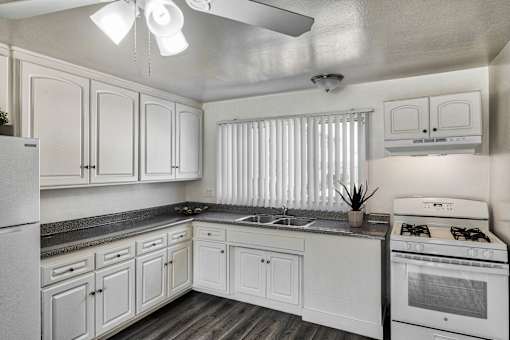Kitchen with modern cabinets at Serrano Apartments, California, 91790