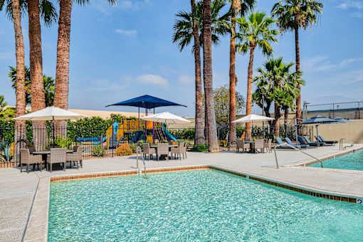Pool and sitting area at Serrano Apartments, West Covina