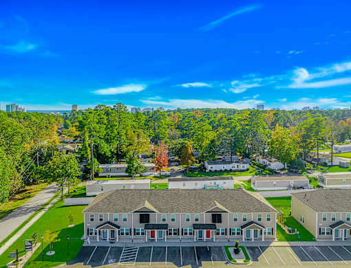 A large building with a parking lot in front of it.