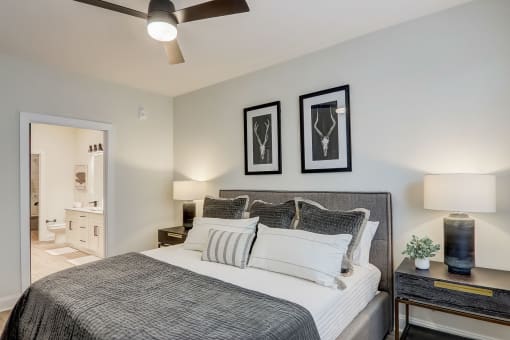 a bedroom with a large bed and two framed pictures on the wall in Asheville NC