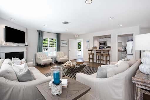 A living room with a grey couch and a coffee table.
