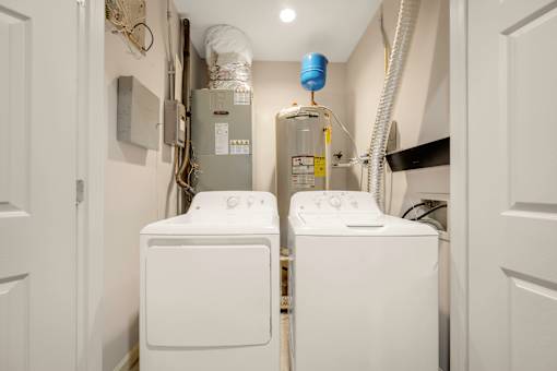 A laundry room with a washer and dryer.