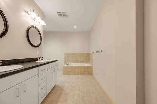 A bathroom with a shower and a sink.