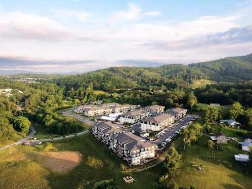 An overhead view of Birch Hill apartments with beautiful mountains in the distance.