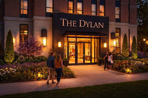 A couple walking towards the entrance of The Dylan hotel.