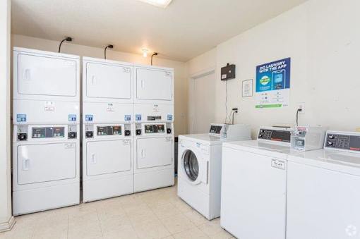 A row of washing machines in a laundromat.